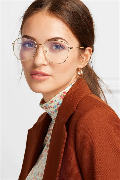 oversized gold frame glasses.